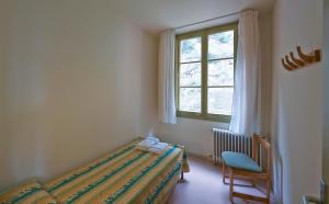 Cama o camas de una habitación en Apartamentos Montserrat Abat Marcet