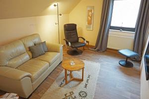Posezení v ubytování Ferienwohnung An der Dorfmauer