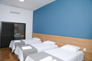 Un pat sau paturi într-o cameră la ONE HOTEL