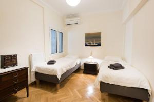 Posteľ alebo postele v izbe v ubytovaní Klokkaris Stays Athens