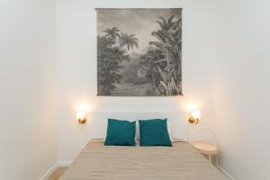 Łóżko lub łóżka w pokoju w obiekcie Canela Homes BARCELONA MARINA
