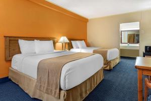 Cama o camas de una habitación en ASAM Hotel