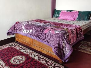 Krevet ili kreveti u jedinici u okviru objekta Swarna Kamal Homestay