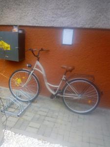 a bike parked next to a wall at Noclegi Grota in Jasło