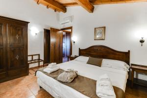 Postel nebo postele na pokoji v ubytování Borgo Magliano Resort