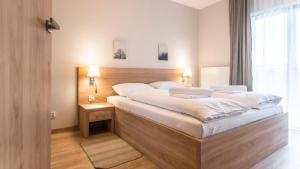 Posteľ alebo postele v izbe v ubytovaní Apartamenty Sun & Snow Resort Karkonosze