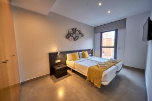 מיטה או מיטות בחדר ב-Bonavista Apartments - Virreina