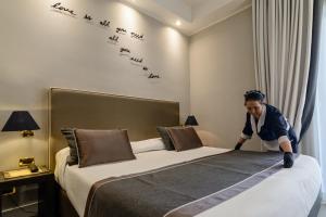 Voodi või voodid majutusasutuse Hotel Cerere toas