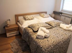 Posteľ alebo postele v izbe v ubytovaní Apartament Perełka Przy Krupówkach