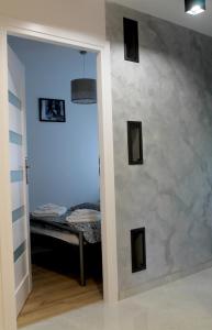 Posteľ alebo postele v izbe v ubytovaní Apartament Perełka Przy Krupówkach
