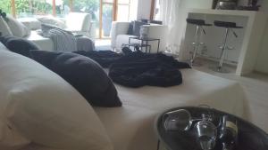 a living room with a couch with pillows on it at K82 apart HOTEL relax&work in Kirchentellinsfurt
