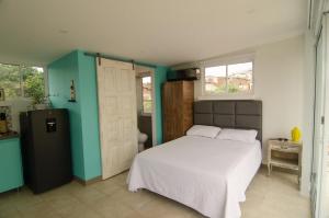 Ένα ή περισσότερα κρεβάτια σε δωμάτιο στο Moonshine Boutique Hostal