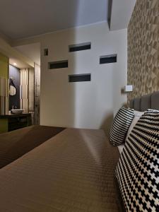 Postel nebo postele na pokoji v ubytování 15 Quindici by Serendipity Rooms
