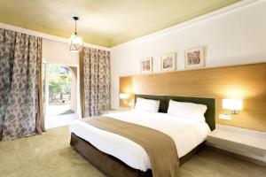 Postel nebo postele na pokoji v ubytování Hotel Riu Tikida Palmeraie - All Inclusive