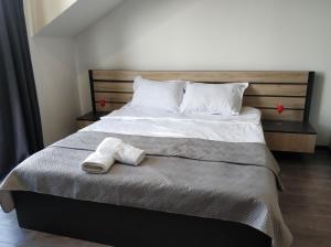 מיטה או מיטות בחדר ב-Favourite