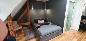 Posteľ alebo postele v izbe v ubytovaní Apartament Vilda