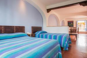 Letto o letti in una camera di Posada del Cafeto