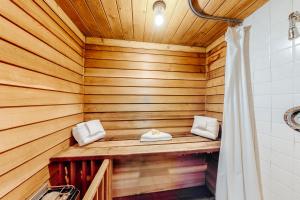 a sauna with wooden walls and a wooden ceiling at Mountain Breeze in Breckenridge +58 photos