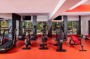 a gym with a bunch of treadmills and machines at Garza Blanca Resort & Spa Los Cabos in Cabo San Lucas