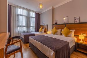 Un ou plusieurs lits dans un hébergement de l'établissement Antalya Business Hotel