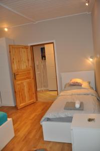 Łóżko lub łóżka w pokoju w obiekcie Cichy Zakątek - ekskluzywny apartament 90 m2