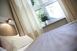 Voodi või voodid majutusasutuse Hotel Domicil Hamburg by Golden Tulip toas