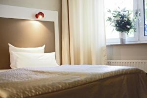 Voodi või voodid majutusasutuse Hotel Domicil Hamburg by Golden Tulip toas