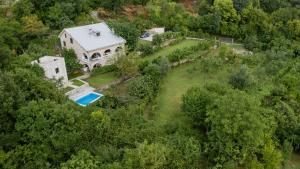 an aerial view of a house with a swimming pool at Village house Vrelo in Mandići