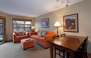 a living room with a couch and a table at The Aspens by Whistler Premier in Whistler