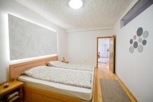 a bedroom with a bed and a picture on the wall at Village house Vrelo in Mandići +23 photos