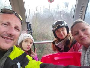 a group of people riding on a train at Le Patio de Luchon in Luchon