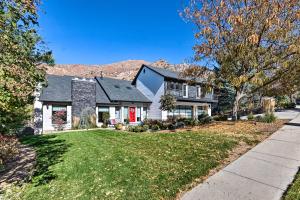 a house with a red door on a street at Cottonwood Heights Apt, 12 Mi to Alta Ski Area! in Cottonwood Heights