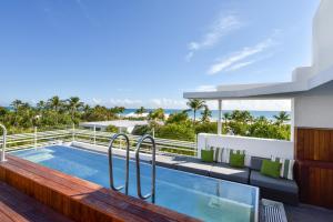 a swimming pool on the balcony of a house at Hotel Breakwater South Beach in Miami Beach