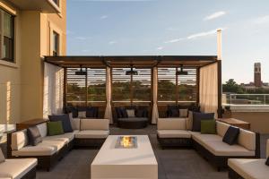 a patio with couches and a fire pit on a building at Kimpton Aertson Hotel, an IHG Hotel in Nashville