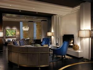 a living room filled with furniture and a fireplace at Kimpton Hotel Palomar Philadelphia, an IHG Hotel in Philadelphia