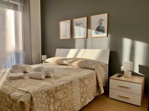 a bedroom with a bed with two stuffed animals on it at Le Muse in Reggio di Calabria