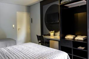 Postel nebo postele na pokoji v ubytování Castro's Hotel