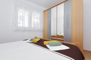 Posteľ alebo postele v izbe v ubytovaní Apartment Alexa