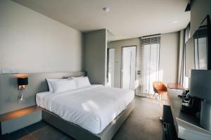 Postel nebo postele na pokoji v ubytování Doowall Hotel