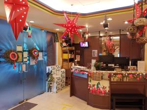 a christmas store with christmas decorations on the counter at La Mode (Sophia) Hotel in Singapore