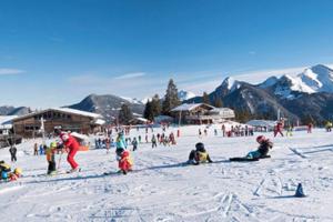 a group of people on a ski slope in the snow at Les Cimes, Chaleureux studio 4 pers, 50m du télécabine, vue dégagée sur les pistes, DRAPS NON COMPRIS in Saint-Jean-d'Aulps