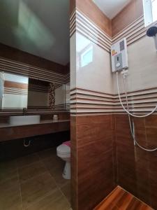Ett badrum på Araya Cottage