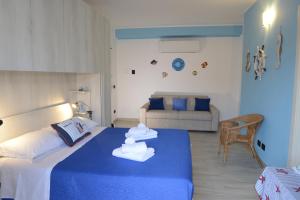 Postel nebo postele na pokoji v ubytování B&B LaMarina