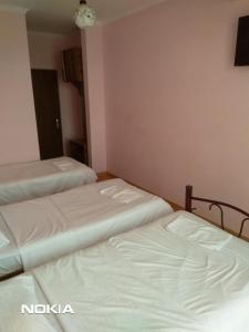 Postel nebo postele na pokoji v ubytování NNN Tourist