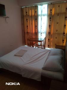 Postel nebo postele na pokoji v ubytování NNN Tourist