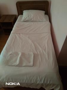 Postel nebo postele na pokoji v ubytování NNN Tourist