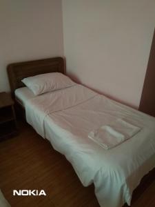 Postel nebo postele na pokoji v ubytování NNN Tourist