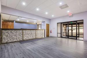 an empty room with a stone wall at Quality Inn in Grayville
