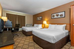 Ένα ή περισσότερα κρεβάτια σε δωμάτιο στο Comfort Inn Val D'Or