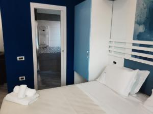 Ένα ή περισσότερα κρεβάτια σε δωμάτιο στο Hotel Calypso